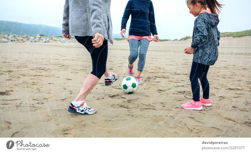 Three generations female playing soccer on the beach Lifestyle Joy Happy Playing Beach Child Human being Woman Adults Mother Grandmother Family & Relations Feet