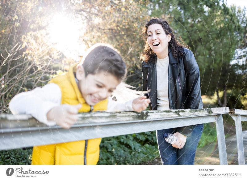 Mother and son playing and laughing outdoors Lifestyle Joy Happy Leisure and hobbies Playing Sun Mountain Mother's Day Parenting Education Child Human being