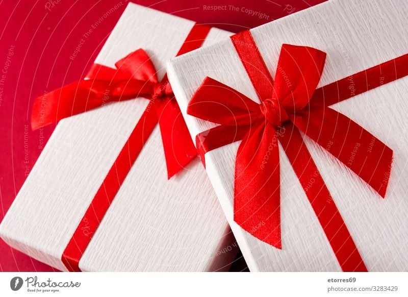 Assorted white gift boxes on red background. Gift Christmas & Advent Box Carton Bow String Present Day Red Birthday Vacation & Travel Feasts & Celebrations