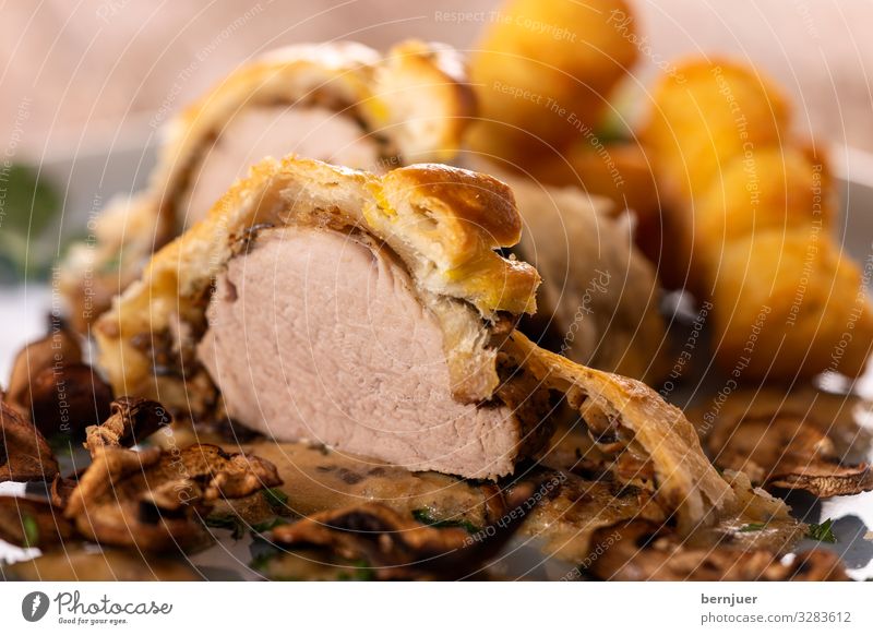 Pork fillet in puff pastry Meat Cake Dinner Plate Table Warmth Wood Fresh Delicious Pork tenderloin Crisp Flaky pastry filled Crust Button mushroom Potatoes