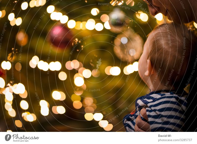 Mother and child at Christmas in front of a glowing Christmas tree Christmas & Advent Mother with child Christmassy Together Love Fairy lights Tradition