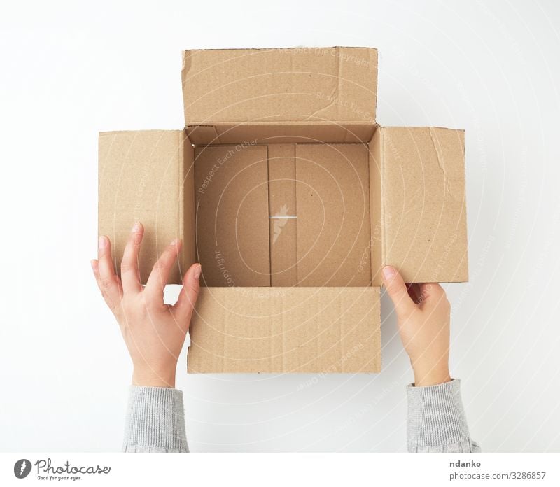 open empty square brown cardboard box Craft (trade) Business Hand Bottom Transport Container Pack Paper Packaging Package Clean Brown Yellow White Hold Storage