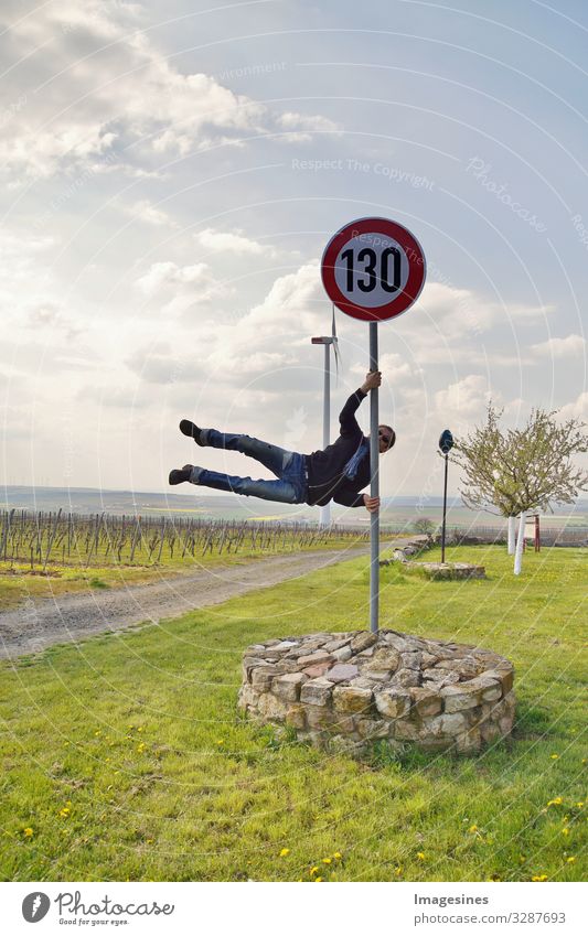 Speed limit 130 km/h or mph. German highway speed limit sign. athletic man in street clothes dancing on pole. in shape of human flag. Germany road sign with 130 km/h speed limit. Concept for traffic