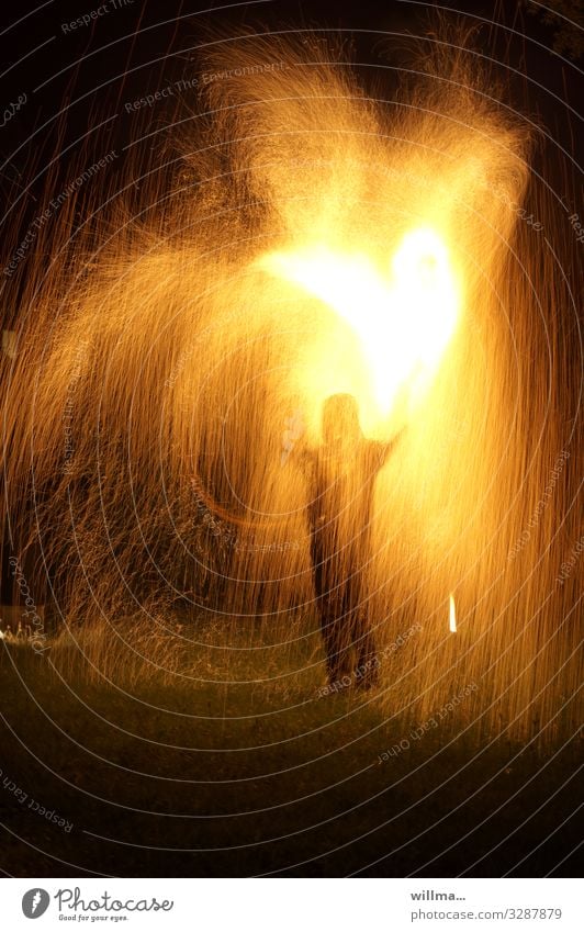 Man stands in the middle of a shower of sparks with a burning heart Human being Fire Spark shower of fire Hot Heart Burn Love Valentine's Day Infatuation