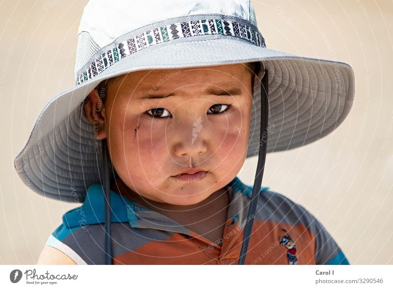 sunny boy Masculine Child Toddler Boy (child) Head Eyes Nose Mouth 1 Human being 1 - 3 years Nature Mongolia Asia T-shirt Hat Sunhat Black-haired Looking