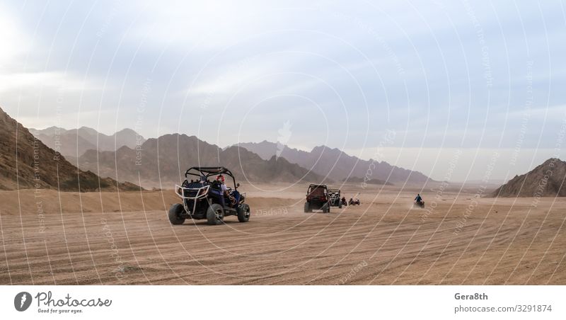 trip of tourists to the desert on the offroad buggy in Egypt Relaxation Vacation & Travel Tourism Trip Adventure Summer Mountain Group Landscape Sand Sky Clouds