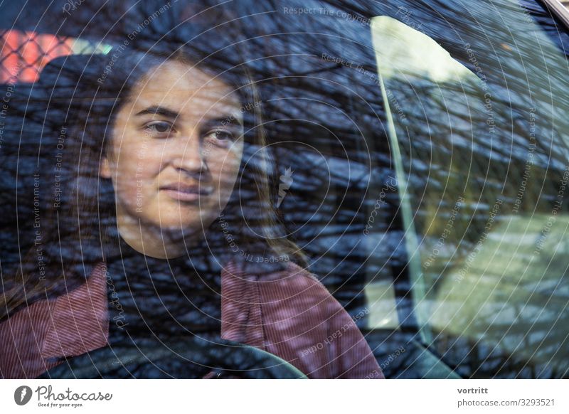behind Tree Life Car Driving Woman Steering wheel Reflection Window Young woman Colour photo Exterior shot Structures and shapes Looking