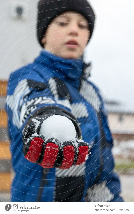 snowball fight Life Leisure and hobbies Playing Vacation & Travel Parenting Child Schoolyard Boy (child) 1 Human being Winter Jacket Gloves Cap Touch To hold on
