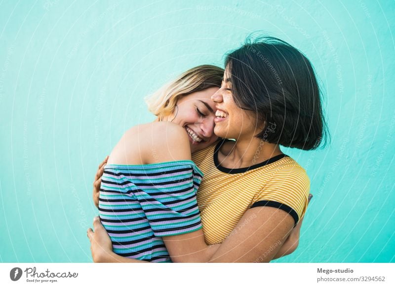 Loving lesbian couple hugging. Lifestyle Happy Leisure and hobbies Freedom Homosexual Woman Adults Couple Love Embrace Happiness Together Romance Relationship