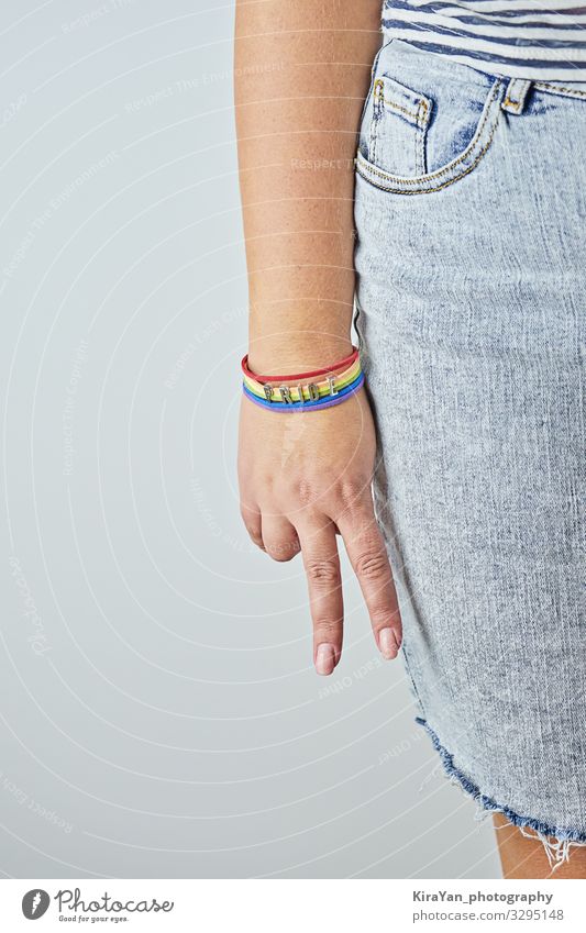 Female palm with V-sign with rainbow bracelet Lifestyle Happy Freedom Feasts & Celebrations Human being Homosexual Woman Adults Arm Hand Signage Warning sign
