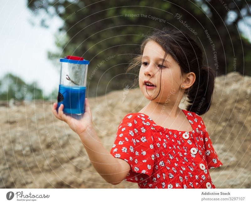 Girl examining bug in jar girl summer examine curious little kid nature catch child cute adorable lovely insect container countryside lifestyle rest relax