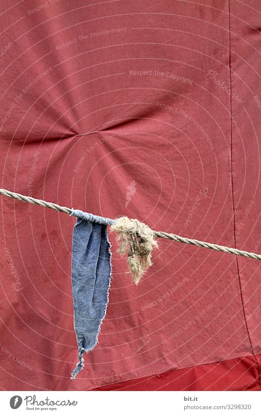 Blue flag, pennant, flag hangs on the rope, cord with knots, in front of tent tarpaulin in red, with pulled together fabric, to fold, at an event. Tent Knot