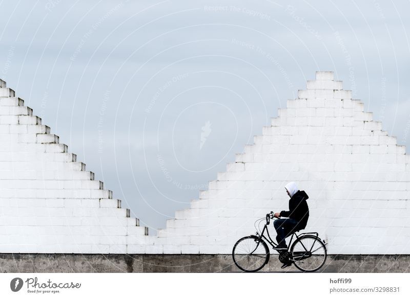 City pyramid and cyclists Cycling Bicycle Human being 1 Town Manmade structures Wall (barrier) Wall (building) Stairs Means of transport Traffic infrastructure