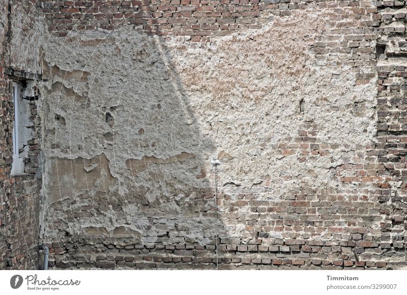 House wall with light and shadow house wall bricks Light Shadow Window Old building Backyard Wall (building) Building Tracks Deserted Town Manmade structures