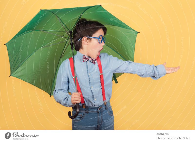 child with green umbrella Joy Winter Human being Masculine Infancy 1 8 - 13 years Child Clouds Autumn Climate Weather Storm Rain Lightning Drought Accessory