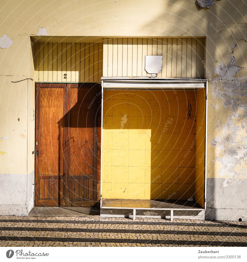 Empty shop / structures brown - yellow - shadow Store premises Shop window Trade Insolvency Funchal Madeira Deserted Stone Wood Glass Stand Sharp-edged Gloomy