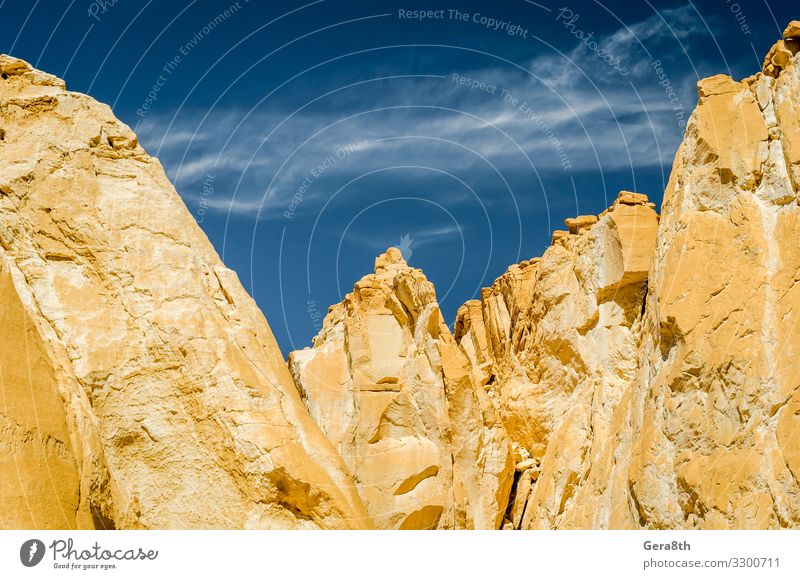 high rocky mountains in Egypt Vacation & Travel Tourism Summer Mountain Nature Landscape Sand Sky Clouds Warmth Hill Rock Canyon Stone Blue White Dahab