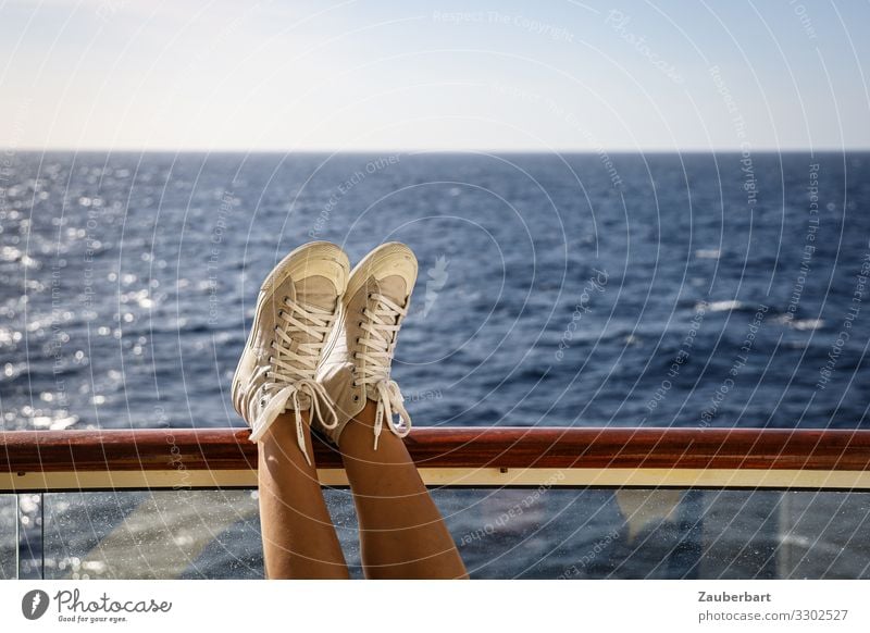 Relaxation and sea Vacation & Travel Freedom Cruise Ocean Balcony Handrail Woman Adults Legs Feet 1 Human being 30 - 45 years Sky Navigation Sneakers To enjoy