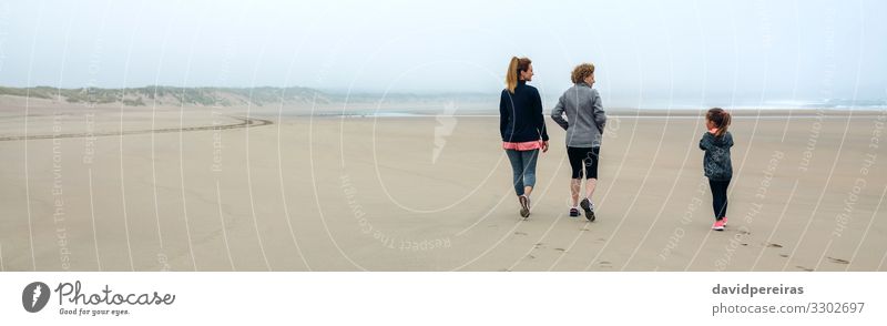 Three generations female walking on the beach Lifestyle Beach Child Internet Human being Woman Adults Mother Grandmother Family & Relations Sand Sky Autumn Fog