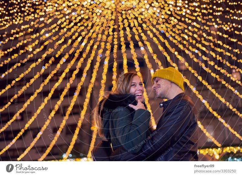 Young couple on the christmas lights of Vigo Happy Beautiful Vacation & Travel Winter Decoration Feasts & Celebrations Human being Couple Tree Town Building
