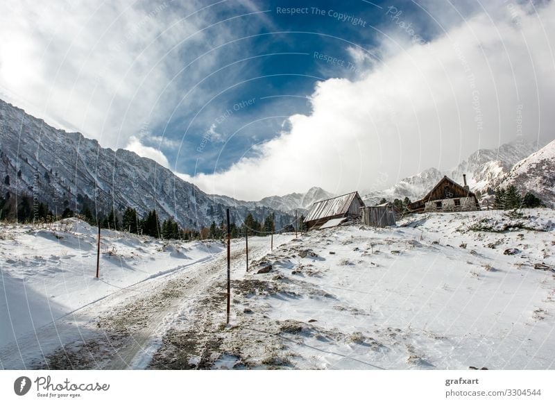 Mountain Hut with Snow between High Mountains in Winter in Austria abandoned alp alpine alps austria calm climate climate change clouds cloudscape cold
