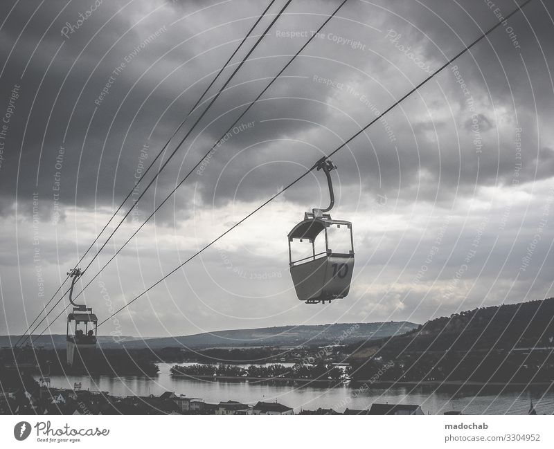 aerial cableway Cable car Transport mountains Mountain Gondola Rope Wire cable Downward Exterior shot Tall Sky Upward Nature Mobility Passenger traffic cloudy