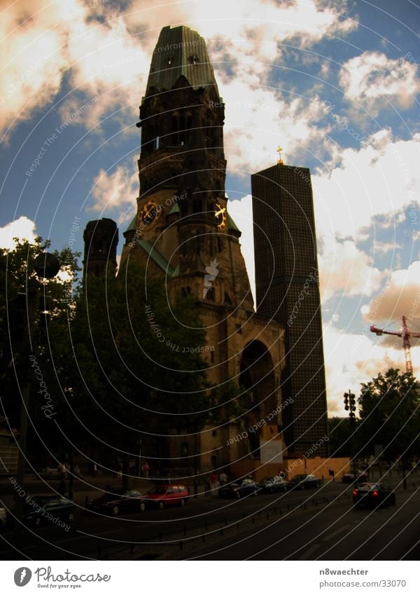 Memorial church 11 am 5 pm Tower clock Roof Clouds Gedächtnis Kirche House of worship Religion and faith Sky crane Car Berlin