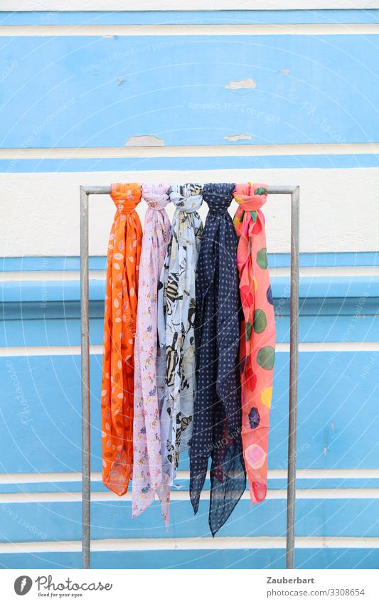 Colorful scarves in front of light blue wall Store premises Wall (barrier) Wall (building) Fashion Clothing Neckerchief Rag Scarf Pillar Hallstand Shopping Hang