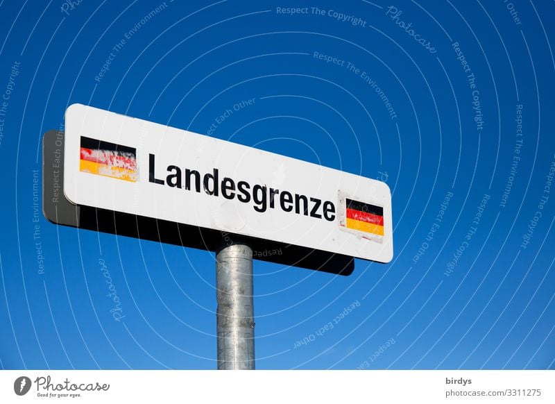 Sign National border Germany in front of a blue sky, on a pedestrian path in the border area Germany - Switzerland Cloudless sky Climate change