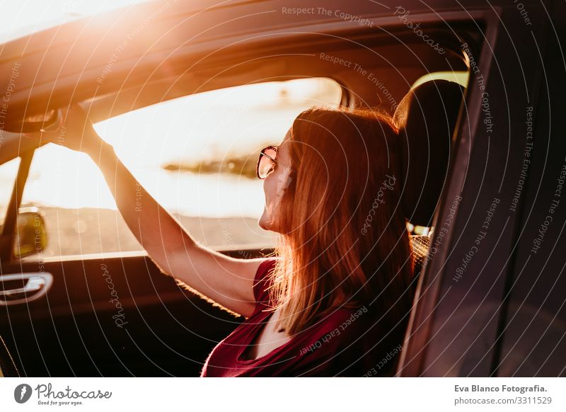 young woman driving a car at sunset. travel concept Youth (Young adults) Woman Car Driving Sunset Beach Driver Vacation & Travel Traveling Trip Lifestyle