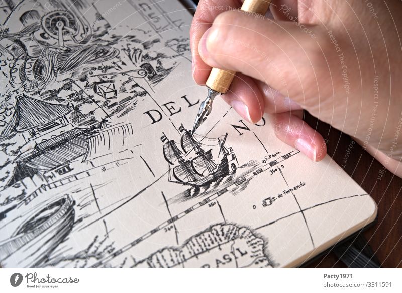 Detail of a hand drawing a manga figure in a sketchbook with a drawing pen  - a Royalty Free Stock Photo from Photocase