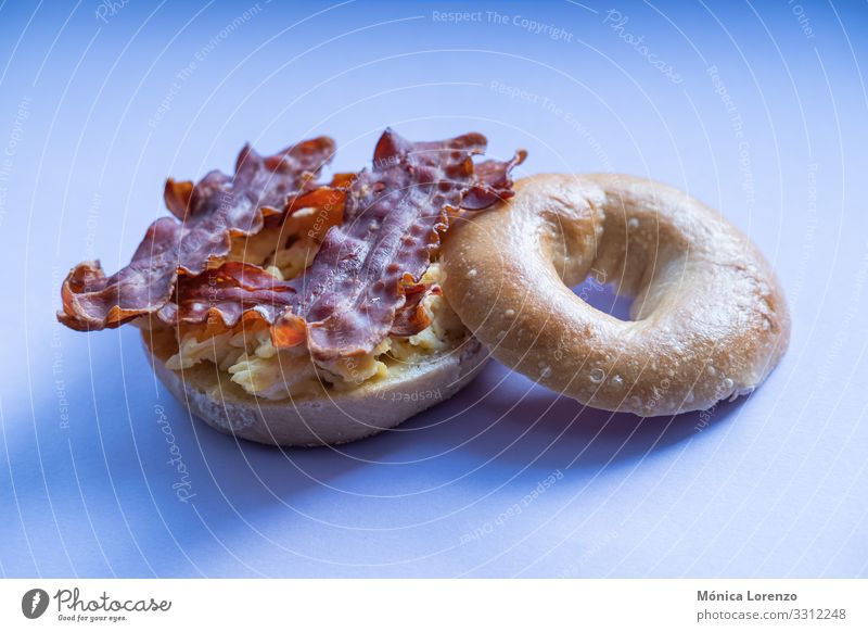 Bacon and scrambled eggs bagel isolated on purple background. Cheese Dough Baked goods Bread Eating Breakfast Diet Stove & Oven Fresh Smoked fish roll grain