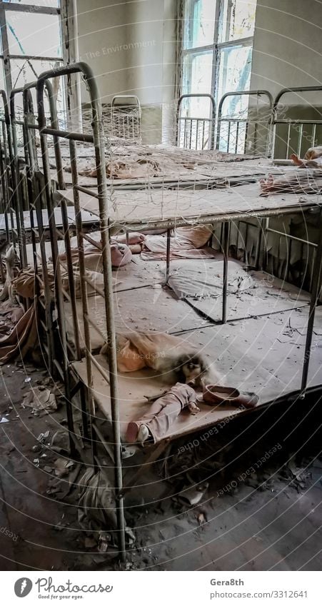 empty beds in an abandoned kindergarten house in Chernobyl Kindergarten Building Old Dangerous abandoned house accident children's beds Ecological