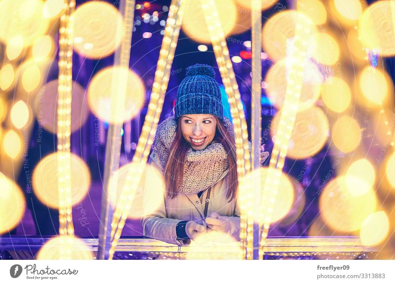 Portrait of a young woman enjoying christmas lights Lifestyle Beautiful Relaxation Winter Feasts & Celebrations Christmas & Advent Human being Young woman