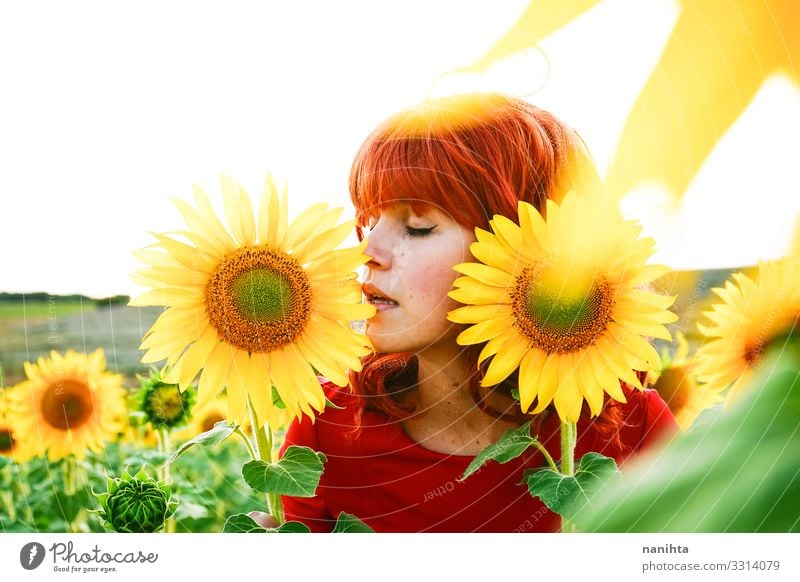 Lovely redhead woman enjoying the day in a field o sunflowers Lifestyle Style Joy Beautiful Freedom Summer Human being Feminine Young woman Youth (Young adults)