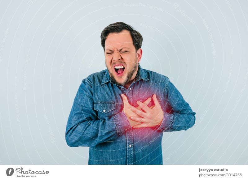 Man with expression of chest pain or heart attack 30 - 45 years Advertising angina arrhythmia Beard Blood pressure cardiac Cardiovascular system Chest