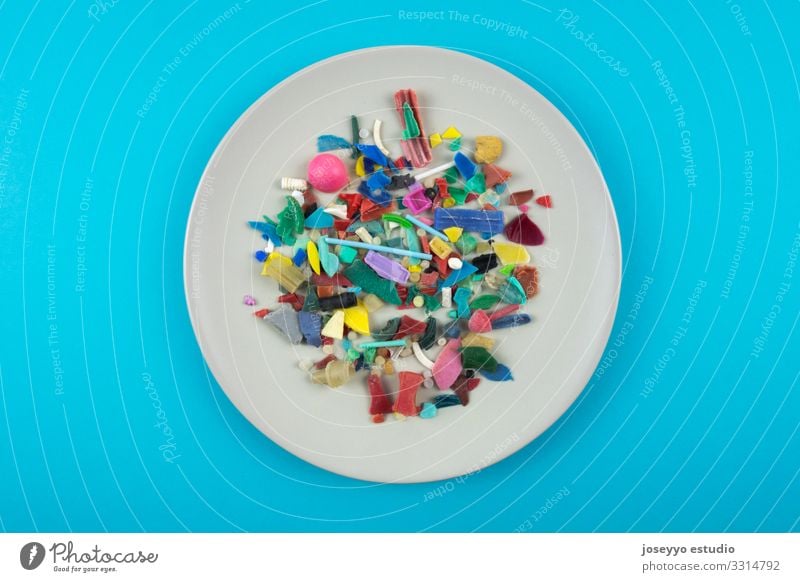 Plate full of micro plastics. Plastic pollution concept. Ocean activists Awareness Close-up Coast damage Destruction Dirty Earth Environment Food fragments