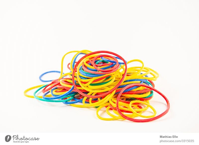 a lot of colored rubber bands on a white background, Stock image