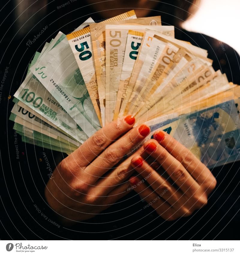 Hands that hold a lot of banknotes fanned out: wealth, fortune, savings. Human being Feminine Fingers Money Generous Loose change Many Bank note assets Euro