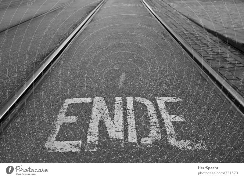 This is the ENDE Town Characters Gloomy Black White End Rail transport Railroad tracks Tram Lettering Road sign Letters (alphabet) Pavement Street