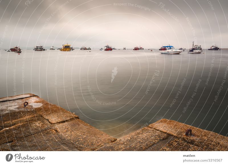 parking space Sky Storm clouds Horizon Summer Bad weather Coast Ocean Navigation Boating trip Fishing boat Sport boats Harbour Blue Multicoloured Yellow Gray