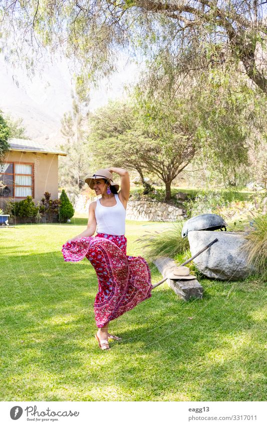 Pretty woman dancing flamenco in the garden of the house Elegant Style Happy Beautiful Body Face Vacation & Travel Summer House (Residential Structure) Garden