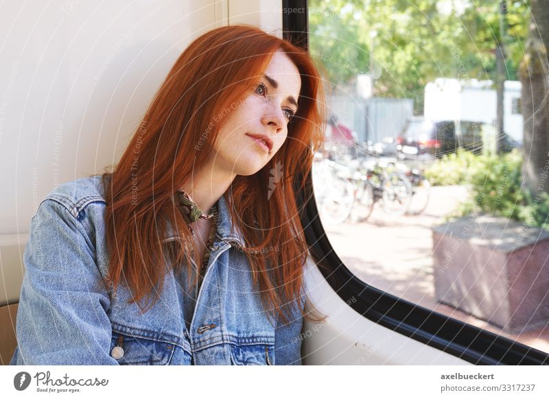 young woman sitting in tram looking out of the window Lifestyle Vacation & Travel Trip Human being Young woman Youth (Young adults) Woman Adults 1 18 - 30 years