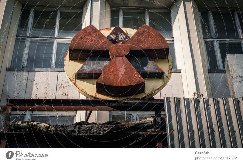 radioactive symbol on the facade of the building in Chernobyl Vacation & Travel Tourism Trip Autumn Building Architecture Rust Old Threat Disaster