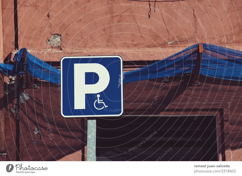 wheelchair traffic signal on the street in Bilbao city Spain symbol disabled disabled sign parking accessibility care road road sing asphalt handicapped icon