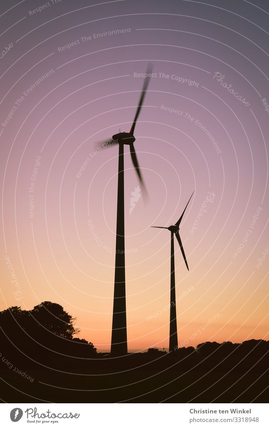Wind turbines in the evening light Wind energy plant Technology Climate Neutral Advancement Future Energy industry Renewable energy Sky Environmental pollution