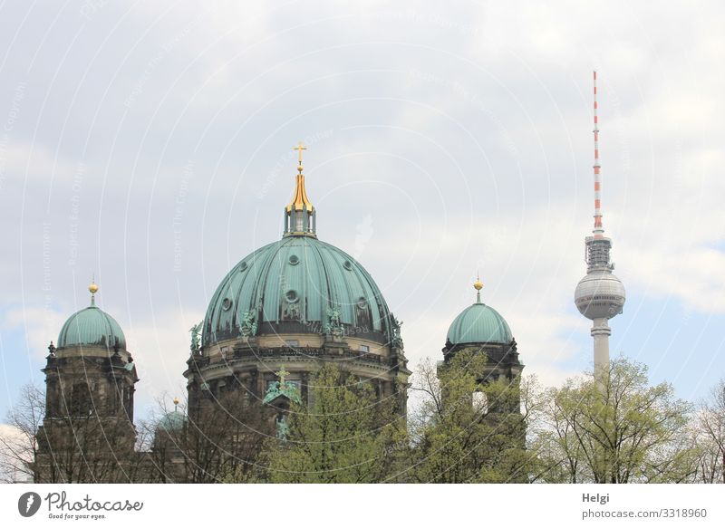 Berlin Cathedral and television tower against a cloudy sky Environment Nature Sky Clouds Tree Capital city Downtown Dome Manmade structures Building