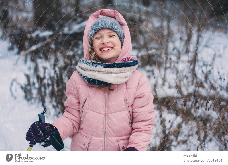 happy child girl skiing in winter snowy forest Joy Happy Relaxation Leisure and hobbies Vacation & Travel Adventure Winter Snow Sports Child