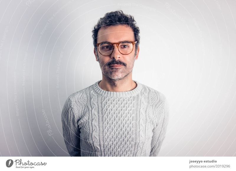 Man with mustache and glasses standing looking at camera. Adults Attractive Brown Cancer Casual clothes Caucasian Charming Self-confident Cool (slang)