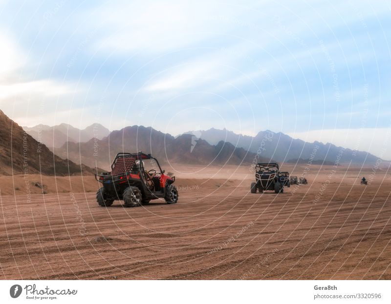 cars buggy with tourists on a trip to the desert in Egypt Vacation & Travel Tourism Trip Adventure Mountain Group Nature Landscape Sand Sky Clouds Climate Rock